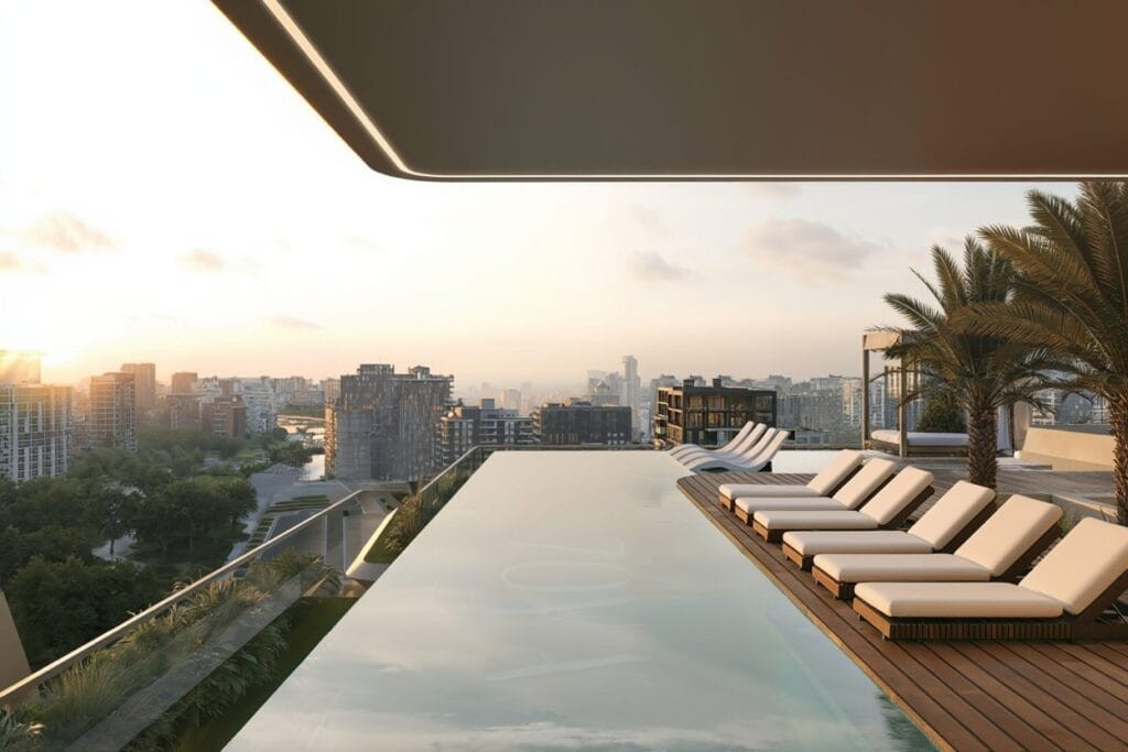 Piscine à débordement sur le toit d'IZEL au coucher du soleil