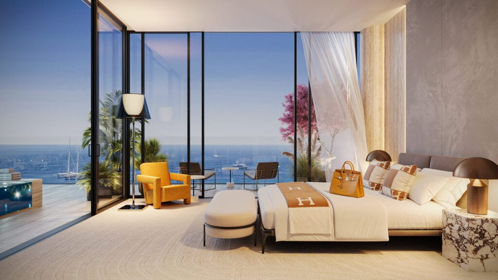 Chambre principale d'une suite Villa del Divos avec baies vitrées sur la mer